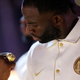 SAN FRANCISCO, CALIFORNIA - OCTOBER 18: Draymond Green #23 of the Golden State Warriors inspects his championship ring during a ceremony prior to the game against the Los Angeles Lakers at Chase Center on October 18, 2022, in San Francisco, California.